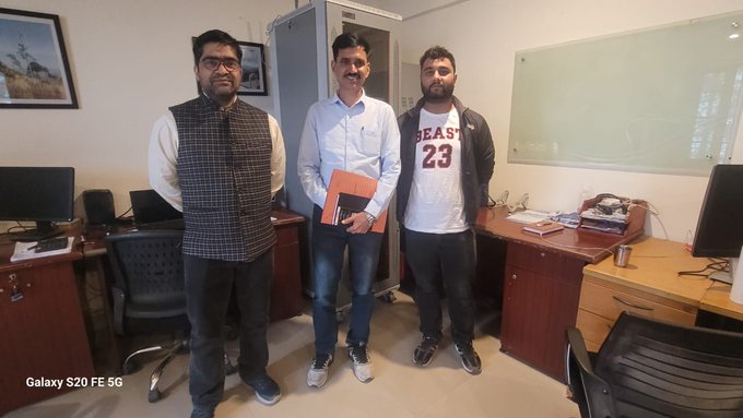 Officials and participants during telecom department event